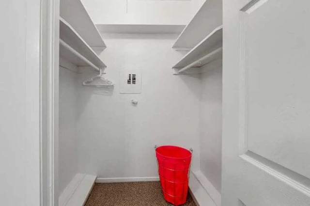 Closet with shelves red bin and hanger closet at University Terrace Apartments in State College Student Accommodation