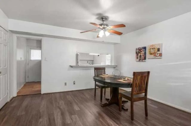Dining table with chairs and kitchen pass through dining area at University Terrace Apartments in State College Student Accommodation