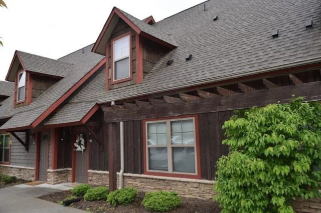 Exterior of apartments with dark wood and stone at Forrest Edge Townhomes in Boone Student Accommodation