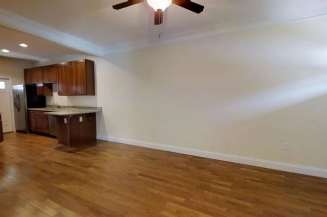 Wooden floor cabinets and refrigerator kitchen at Forrest Edge Townhomes in Boone Student Accommodation