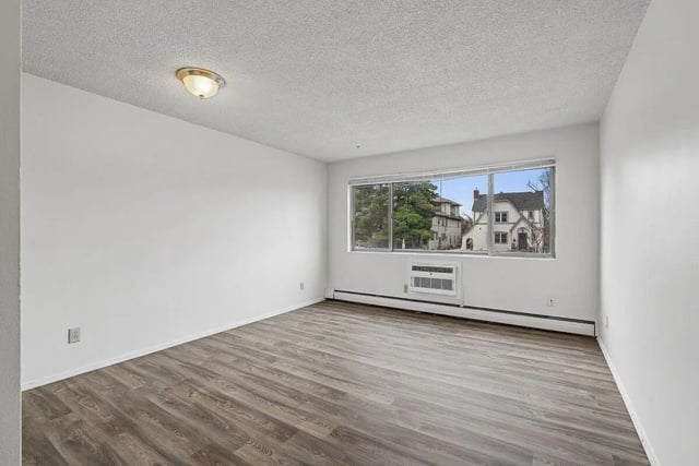 Empty room with wood floor and window living room at Marcy Park Student Housing Co-op in Minneapolis Student Accommodation