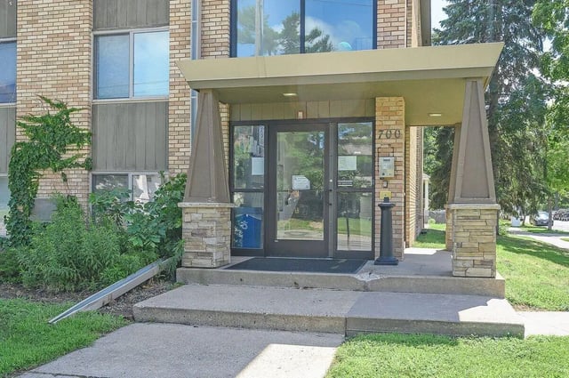Double glass doors with address 700 exterior at Marcy Park Student Housing Co-op in Minneapolis Student Accommodation
