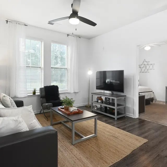 Sofa coffee table TV on stand living room at Millennium One Apartments in Charlotte Student Accommodation