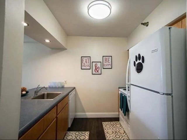 Kitchen with fridge sink and cabinets kitchen at Greenwich Court Apartments in State College Student Accommodation