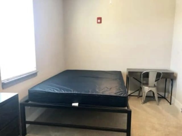 Bed dresser desk and chair bedroom at Plaza One 89 in Clemson Student Accommodation