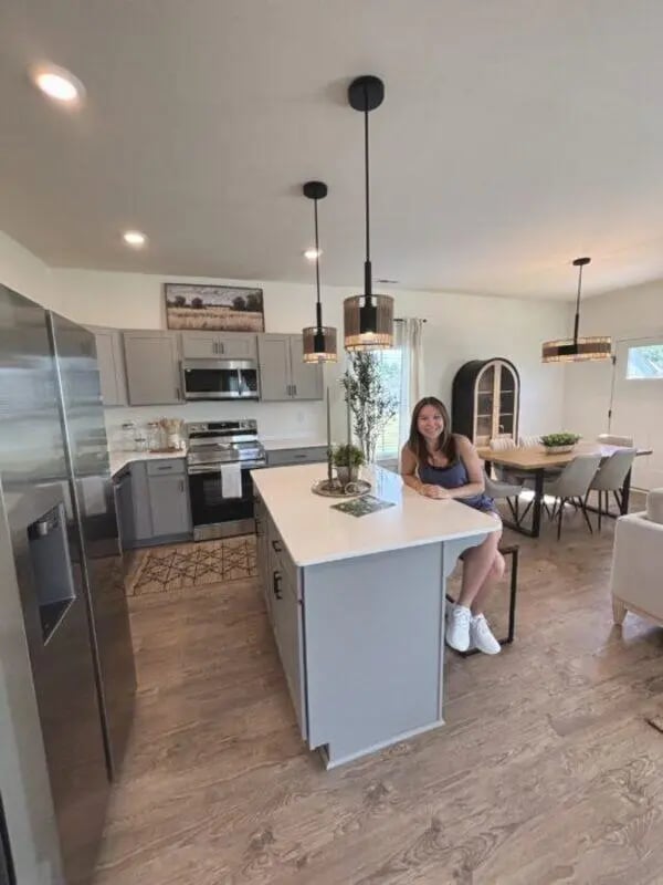 Modern kitchen island, cabinets, dining table, living area kitchen at Maverick Hills in Central Student Accommodation