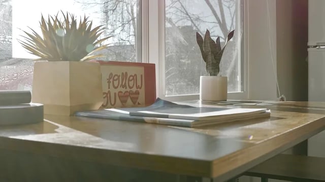 Plants and sign on desk study area at Thirty One Apartments in Seattle Student Accommodation