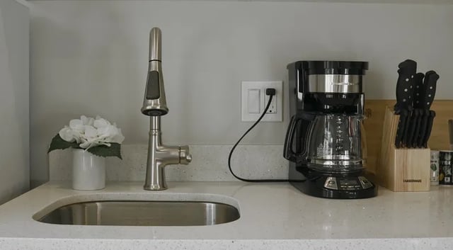 Sink faucet coffee maker knives kitchen at Thirty One Apartments in Seattle Student Accommodation
