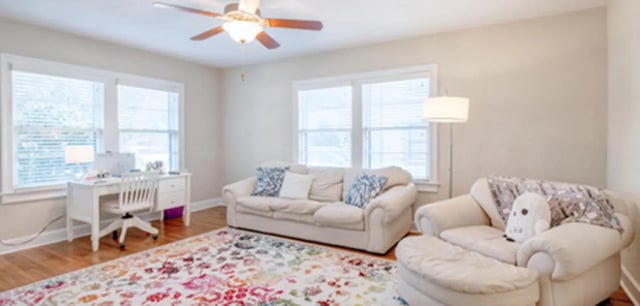 White desk chair couch with cushions and rug living room at Greystone Luxury Apartments in Gainesville Student Accommodation