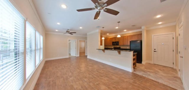Open living space with kitchen bar and entry living room at Greystone Luxury Apartments in Gainesville Student Accommodation