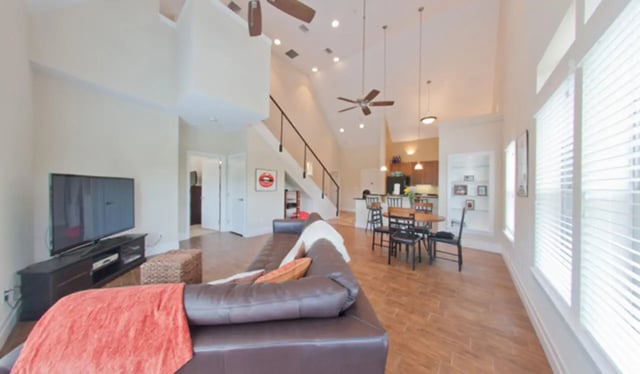 Sofa TV dining table kitchen living area at Greystone Luxury Apartments in Gainesville Student Accommodation
