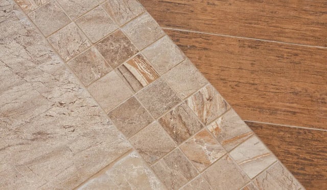 Brown wood plank and stone tile flooring pattern flooring at Greystone Luxury Apartments in Gainesville Student Accommodation
