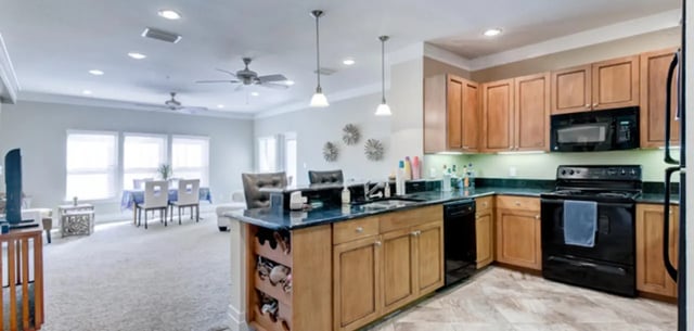 Kitchen with dining and living areas. at Greystone Luxury Apartments in Gainesville Student Accommodation