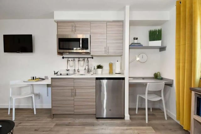 Compact kitchen with desk and TV studio kitchen at U20 Apartments in Seattle Student Accommodation