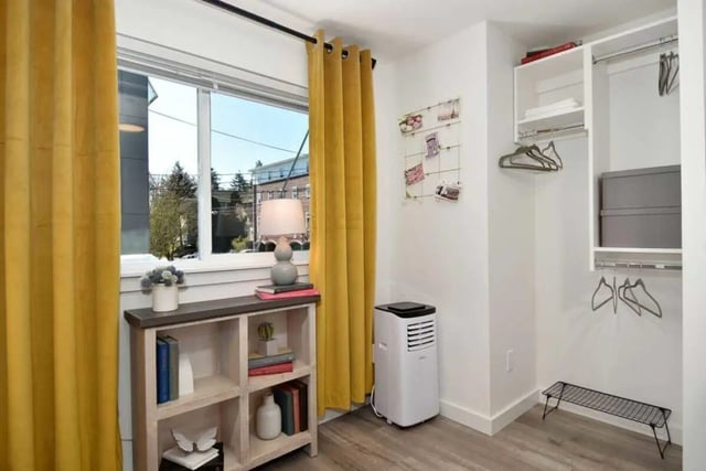 Bookshelf lamp AC window and closet bedroom at U20 Apartments in Seattle Student Accommodation