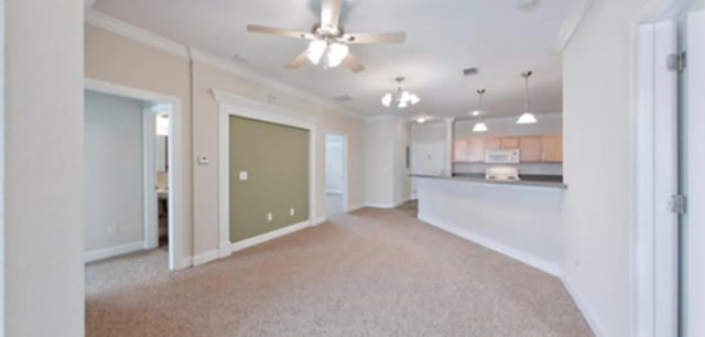 Living room and kitchen with ceiling fans at Stratford Court Luxury Apartments in Gainesville Student Accommodation