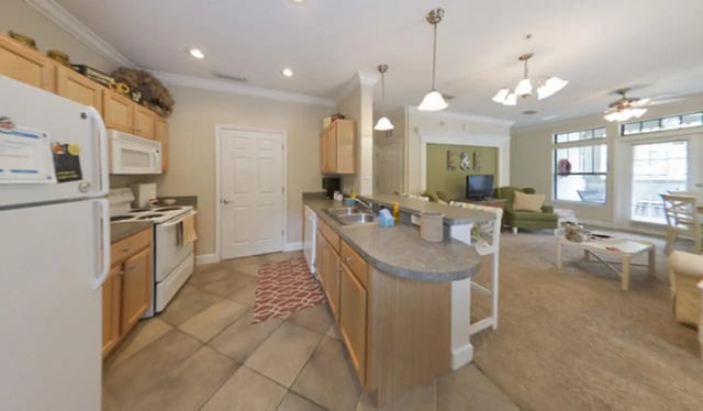 Kitchen counter with sink and living room area at Stratford Court Luxury Apartments in Gainesville Student Accommodation