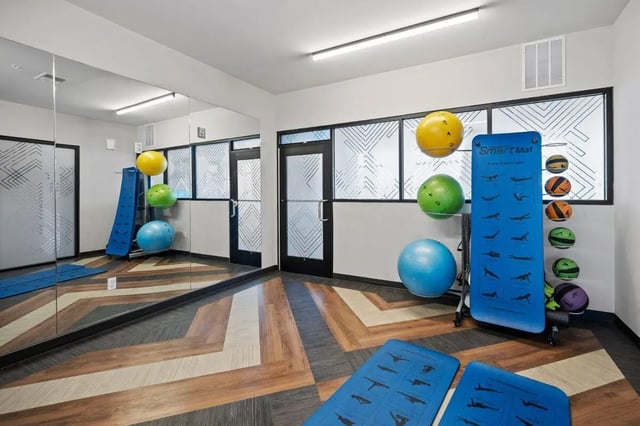 Exercise balls yoga mats and slidemats fitness room at The Eden Apartments in Cincinnati Student Accommodation