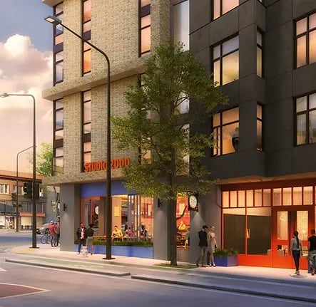 Modern building with cafe entrance and people exterior at Aquatic at U in Berkeley Student Accommodation
