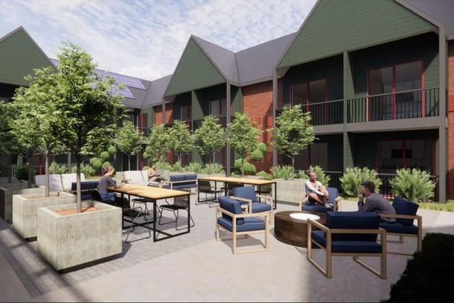 Courtyard seating tables trees balconies exterior at Abigail Court in Gresham Student Accommodation