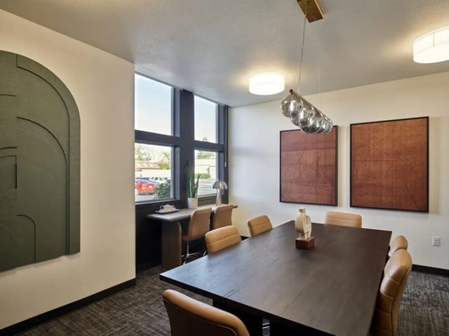 Dining table with chairs study desk and art. at Abigail Court in Gresham Student Accommodation
