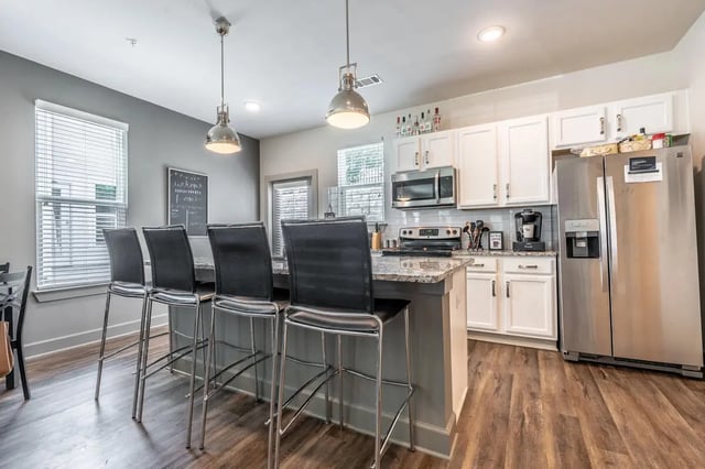 Bar stools and kitchen island kitchen at Boulevard in Milledgeville Student Accommodation