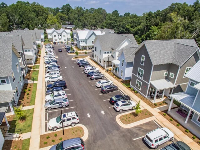 Apartments with parked cars exterior at Boulevard in Milledgeville Student Accommodation