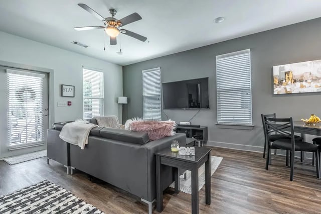 Grey sofa dining set TV modern living room at Boulevard in Milledgeville Student Accommodation