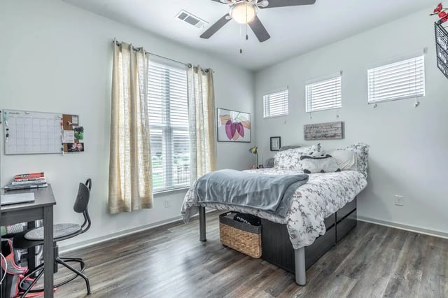 Bed desk white board and fan bedroom at Boulevard in Milledgeville Student Accommodation