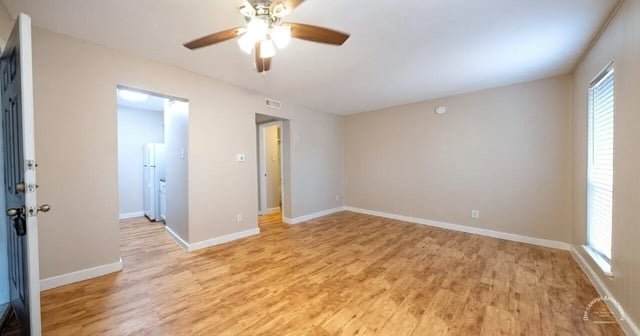 Open door ceiling fan and kitchen area living room at Barranca Square Student Apartments in Austin Student Accommodation