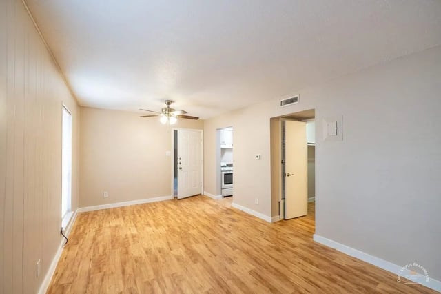 Wood floors fan door leading to kitchen living room at Barranca Square Student Apartments in Austin Student Accommodation