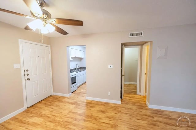 Door fan kitchen and hallway interior at Barranca Square Student Apartments in Austin Student Accommodation