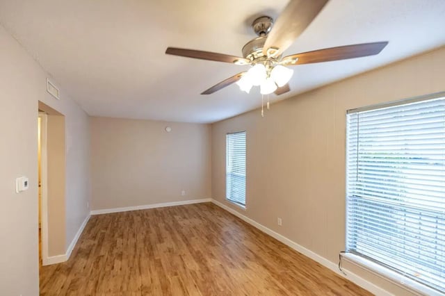 Ceiling fan with lights wood floor empty room living room at Barranca Square Student Apartments in Austin Student Accommodation