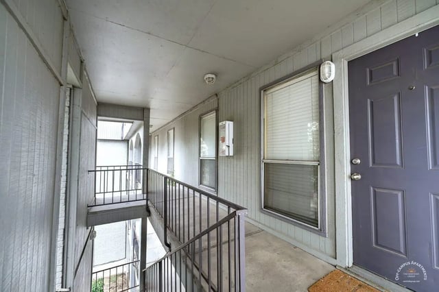 Walkway with railings windows and doors exterior at Barranca Square Student Apartments in Austin Student Accommodation