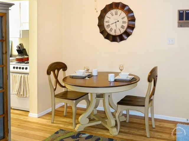 Dining table with chairs and kitchen area dining area at Barranca Square Student Apartments in Austin Student Accommodation
