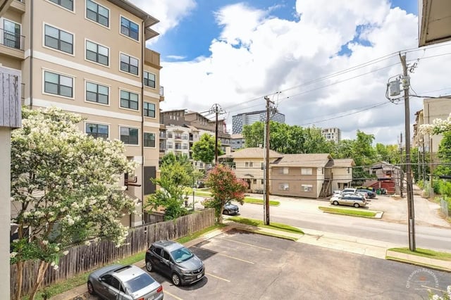 Apartment building cars parking lot exterior at Barranca Square Student Apartments in Austin Student Accommodation