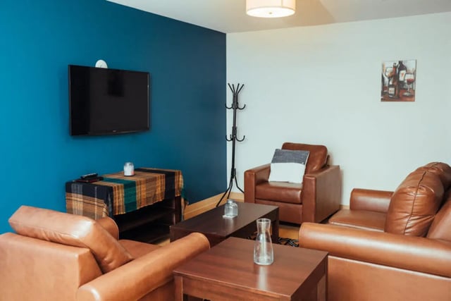 Brown leather sofas and armchair living room at Copper Beech Commons Student Housing in Syracuse Student Accommodation