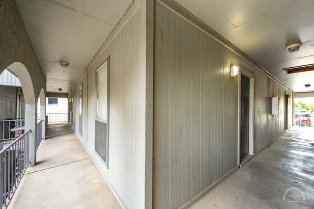 Exterior walkway with doors and windows outdoor area at Barranca Square Student Apartments in Austin Student Accommodation