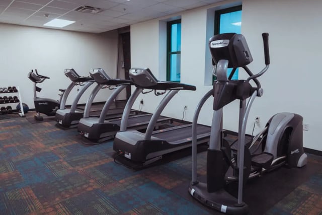 Treadmills stationary bike elliptical gym equipment gym at Copper Beech Commons Student Housing in Syracuse Student Accommodation