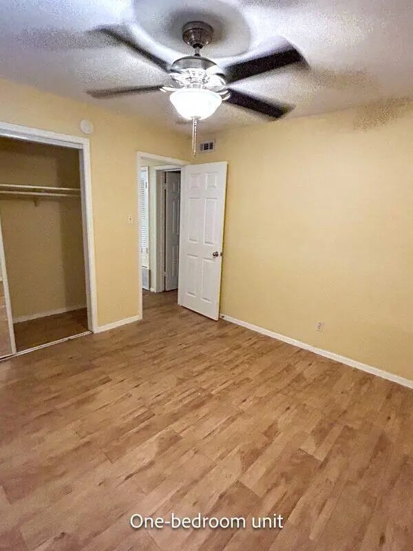 Closet doors white door wood floor bedroom at Barranca Square Student Apartments in Austin Student Accommodation