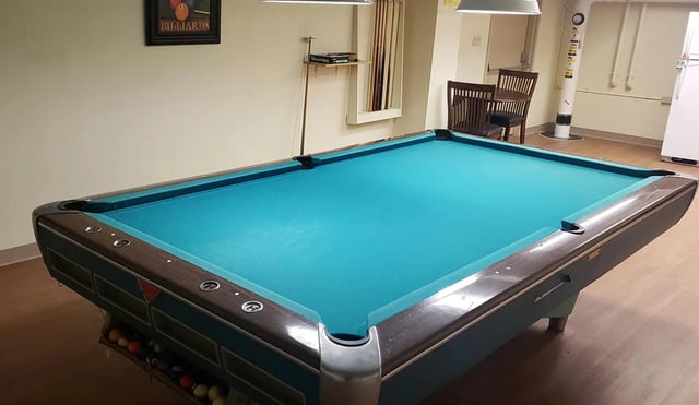 Billiard table pool balls cue rack playing area at 100 Chenango Place in Binghamton Student Accommodation