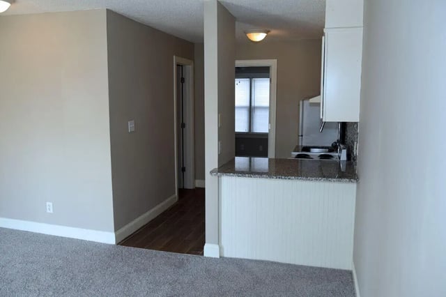 Doorway to kitchen and refrigerator kitchen at Campus Walk at ECU in Greenville Student Accommodation