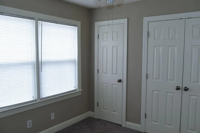 Two white doors and a window bedroom at Campus Walk at ECU in Greenville Student Accommodation