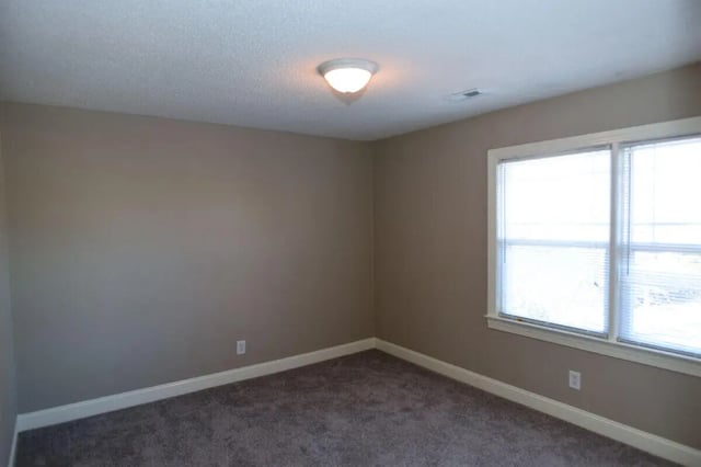 Empty room with light beige walls and carpet bedroom at Campus Walk at ECU in Greenville Student Accommodation