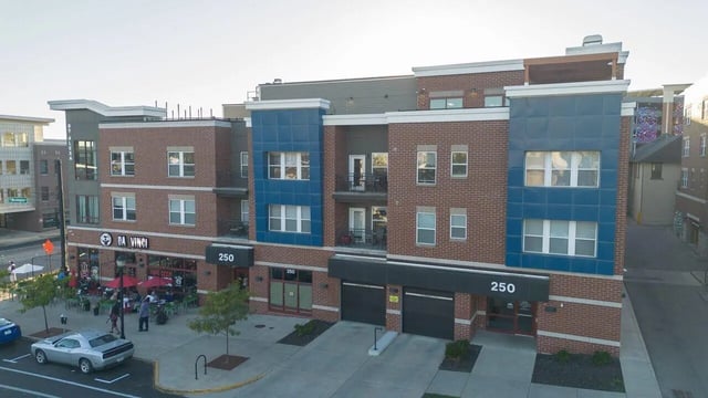 Modern building with brick and blue facade exterior at CitySide By Alexa in Bloomington Student Accommodation
