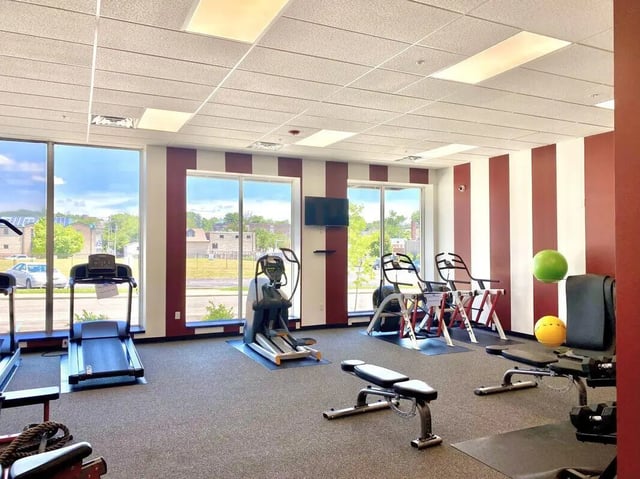 Treadmills elliptical trainer weight bench gym at CitySide By Alexa in Bloomington Student Accommodation
