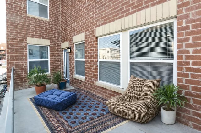Plaid beanbag chair blue floor cushion outdoor living area at CitySide By Alexa in Bloomington Student Accommodation