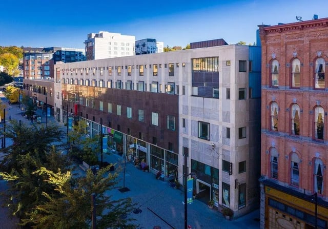 Modern building with retail windows exterior at 407 College Ave in Ithaca Student Accommodation