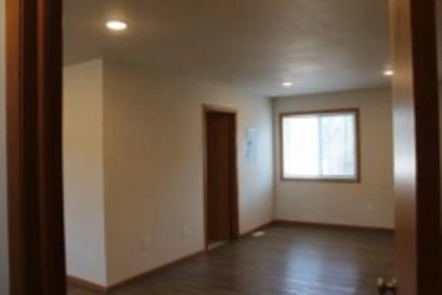 Empty room with wooden floor and window living room at Conifer Creek Townhomes in Allendale Student Accommodation