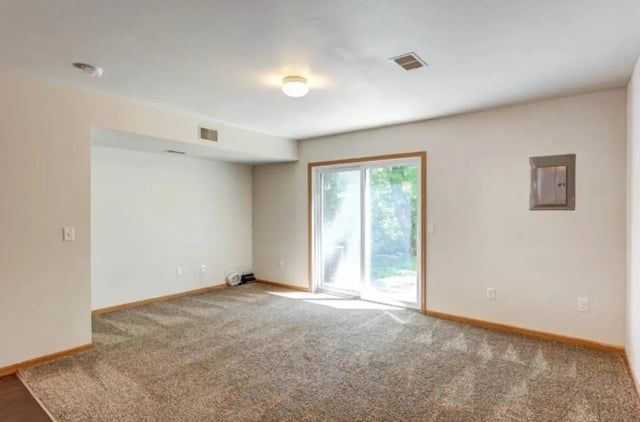 Carpeted room with sliding glass door living room at Conifer Creek Townhomes in Allendale Student Accommodation